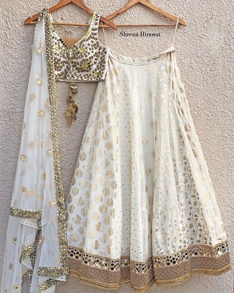 Label Shrena Hirawat on Instagram: “Ivory and gold mirror work blouse teamed with multi kali buti Lehenga and a sheer dupatta, perfect for brides, bridesmaids or sister of the…”