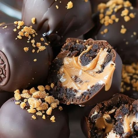 Recipes Mentor on Instagram: "🍫🥜 Reese's Oreo Balls 🍬🍪 ​ 📋 Ingredients: ​ 🍪 1 package (14.3 oz) Oreos (I used peanut butter Oreos) 🧀 1 package (8 oz) cream cheese, softened 🥜 Peanut butter cups (one for each Oreo ball) 🍫 Chocolate Candiquik or almond bark 🍬 Optional toppings: chopped Reese's pieces, peanut butter candy melts ​ 📝 Instructions: ​ 1️⃣ Allow the cream cheese to come to room temperature. 🧀 2️⃣ Pulse half of the Oreos in a food processor until crumbs form, then add the other half and repeat. 🍪🔄 3️⃣ Mix Oreo crumbs with cream cheese until well blended. 🥄 4️⃣ Line a baking sheet with a silicone mat. 🧈 5️⃣ Scoop and form Oreo balls, placing a peanut butter cup inside each. 🍫🥜 6️⃣ Chill the Oreo balls in the fridge for 20 minutes. ❄️🕒 7️⃣ Melt the chocolate Candiq Peanut Butter Oreos, Oreo Ball, Bake Sweets, Oreo Cookie Balls, Butter Candy, Cookie Balls, Reese's Pieces, Peanut Butter Oreo, Yummy Deserts