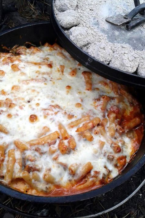 Baked ziti is the ultimate comfort dish that everyone in your family will love. Along with baked pasta, Italian sausage, and spaghetti sauce, add veggies of your choice, like mushrooms and green peppers.   Get the recipe at Three Guys Outside. Easy Dutch Oven Recipes, Dutch Oven Camping Recipes, Dutch Oven Camping, Camping Dinners, Easy Camping Meals, Dutch Oven Cooking, Cast Iron Recipes, Dutch Oven Recipes, Campfire Food