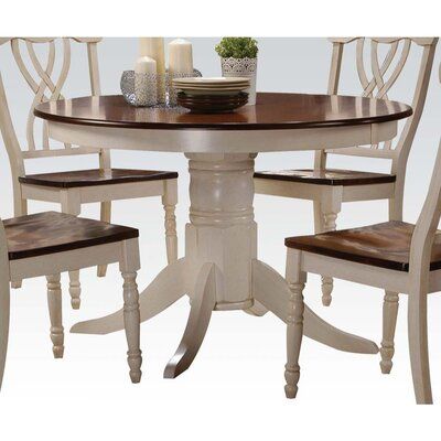 The collection features a round table top with an empire pedestal base, carefully crafted with selected wood and veneers in buttermilk and oak finish. Matching side chairs offer overlapped "X" backrest design, wooden seat top, and turned front legs providing a warm and cozy country style for your dining room. Painted Kitchen Tables, Backrest Design, Round Table Top, Wood Pedestal, Table Ronde, Acme Furniture, Solid Wood Table, Dining Table Top, Pedestal Dining Table