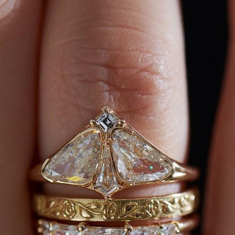 ARTËMER on Instagram: "Romantic stack featuring the Moth ring, rose patten band and half moon frills 🦋 🌹🌗 ⠀⠀⠀⠀⠀⠀⠀⠀⠀ #diamondring #engagementring #finejewelry #alternativebride #bridal #wedding  #artemerstacks  #weddingring  #ringset #ringstack #stackingrings #bridalringset #weddingset #weddingrings #weddingringset #halfmoondiamond #trilliondiamond #carrediamond #embossed #embossedgold #rose #moth #natureinspired #beautyofnature🍃 #beautyofnature" Moth Diamond Engagement Ring, Moth Diamond Ring, Exlectic Engagement Ring, Moth Wedding Ring, Bug Wedding Rings, Moth Engagement Ring, Unique Fine Jewelry, Maximalist Wedding Ring, Unusual Engagement Ring