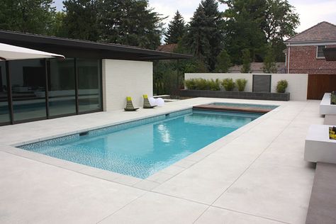 pool, cool chairs, white pool balls, decorative concrete smooth, brush finished pool deck Pool Deck Ideas Inground, Pool Decking Concrete, Cement Pools, Pool Paving, Pool Pavers, Rectangle Pool, Exposed Aggregate, Pool Renovation, Pool Remodel