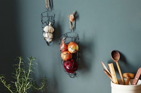 The Charest Studios Wall-Mounted Onion Garlic Basket is made of annealed steel wire and hangs on the wall; $30 to $69 at Food52. Wire Basket Ideas, Onion Storage, House Closet, Hanging Wire Basket, Garlic Storage, Wire Hangers, Wedding Table Centerpieces, Wire Baskets, Dollar Store Crafts