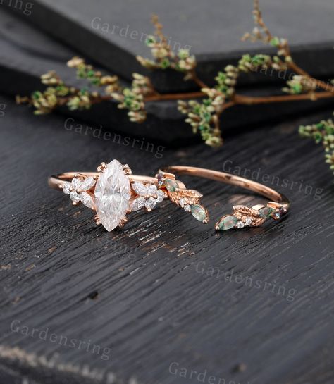 Marquise cut Moissanite Engagement ring set Vintage moss agate wedding band Rose gold Cluster shank Unique leaf Bridal set Anniversary gift ABOUT THIS RING Beautiful Moissanite engagement ring Set -------------------------------------------------------- 「Product Summary」 Engagement Ring * Center Stone: 5*10mm moissanite OR Simulated Diamonds  (Marquise cut) * Side Stones: 1.5*3mm Marquise cut Moissanite                           1.7mm Round Moissanite Or Side Stone: Simulated Diamond * Total Car