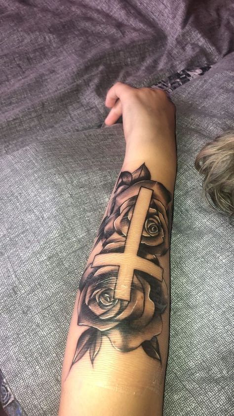 #follow #tattooideas #tattoos #blogging #blog #blogger Crosses With Roses Tattoo, Tattoo Ideas Top Of Arm, Arm Tattoos For Women Outer Forearm, Cross And Roses Tattoos For Women, Cross Rose Tattoo For Women, Arm Tattoos For Women Roses, Rose Tattoo On Forearm For Women, Cross Arm Tattoo Women, Cross And Rose Tattoo For Women