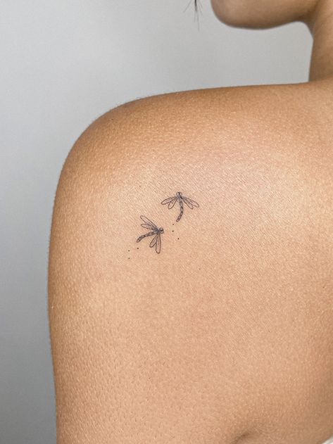 Fine line tattoo of two dragonflies. Los Angeles based tattoo artist. Perfect tattoo for women. Perfect tattoo for men. Perfect tattoo to match with a friend! #tattooartist #finelinetattoo #westerntattoo #losangeles #minimalisttattoo #uniquetattoo #tattooformen #tattooforwomen #flashdesign #halloweentattoo #matchingtattoos Tattoos For Happiness, 3 Dragonflies Tattoo, Matching Dragon Fly Tattoo, Tattoo Ideas Dedicated To Parents, Tattoos To Get For Parents, Small Tattoo Dragonfly, Fine Line Beetle Tattoo, Two Bee Tattoo, Mini Dragon Fly Tattoo