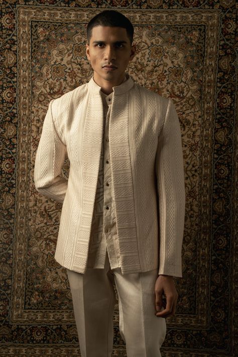 The ivory-layered ensemble exudes a graceful fusion of traditional and contemporary elements, with an unmistakable Indo-Western essence. Crafted from luxurious silk fabric, each layer of the ensemble is adorned with intricate tonal silk thread embroidery, adding an exquisite touch of elegance and sophistication.The ensemble features a stylish kurta with a modern twist, boasting a silhouette that effortlessly blends Eastern and Western influences. The fine embroidery enhances the allure of the ku Indowestern Outfits For Men, Kurta And Pants, Georgette Shirt, Indian Wedding Clothes For Men, Silk Thread Embroidery, Stylish Kurta, Wedding Kurta For Men, Party Outfit Men, Wedding Dresses Men Indian