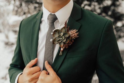 Wedding day dark green suit paired with a succulent boutonniere for a groom. https://www.etsy.com/listing/807177516/bridal-party-floral-package?ga_order=most_relevant&ga_search_type=all&ga_view_type=gallery&ga_search_query=wedding+party+floral+package&ref=sr_gallery-1-8&organic_search_click=1&frs=1 Wedding Suits Green, Fall Wedding Suits, Suits Green, Green Wedding Suit, Dark Green Wedding, Groom And Groomsmen Suits, Wedding Tux, Mens Wedding Attire, Wedding Suits Groom