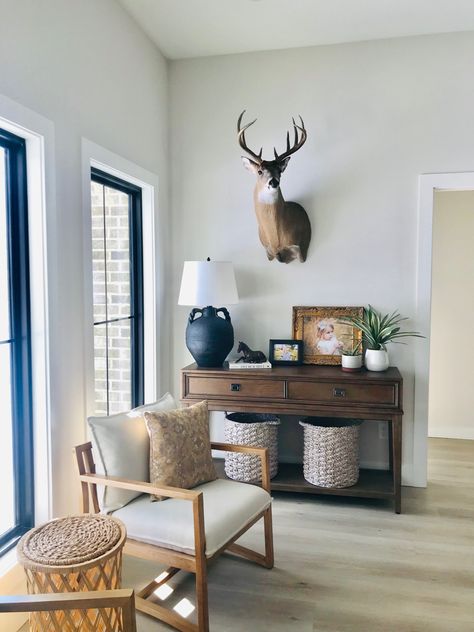 Antlers In Living Room, Deer Head Dining Room, Deer Head Office Decor, Modern Farmhouse Living Room With Deer Mounts, Country Living Room With Deer Heads, Interior Design With Deer Heads, Gallery Wall Ideas With Deer Head, Deer Office Decor, Deer Head Home Decor Wall Mount