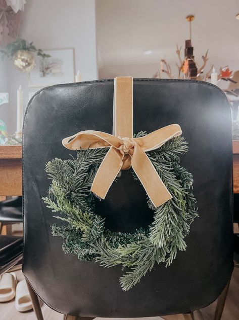 DIY Mini Chair Wreaths for Christmas – Love & Renovations Wreaths On Chairs Christmas Decor, Christmas Wreath On Bar Stool, Holiday Chair Decor, Christmas Dining Chair Decor, Back Of Chair Christmas Decor, Wreath On Chair Back, Diy Mini Wreath Christmas, Chair Wreaths Christmas Decor, Mini Christmas Wreaths Diy