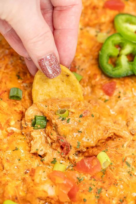 Mexican Chicken Dip Recipe - packed with the perfect blend of zesty salsa, taco seasoning, cream cheese, melty cheese, and tender chopped chicken, this dip is a flavor explosion waiting to happen. Baked until bubbly, it's the ultimate crowd-pleaser, whether you're hosting a game day gathering or a fiesta with friends. Serve it with warm tortilla chips and fresh veggies. Chicken Fajita Dip, Creamy Chicken Taco Dip, Tortilla Dip Recipes, Taco Chicken Dip, Mexican Chicken Dip Recipe, Chicken Taco Dip Recipe, Mexican Chicken Dip, Chicken Taco Dip, Spicy Chicken Dip