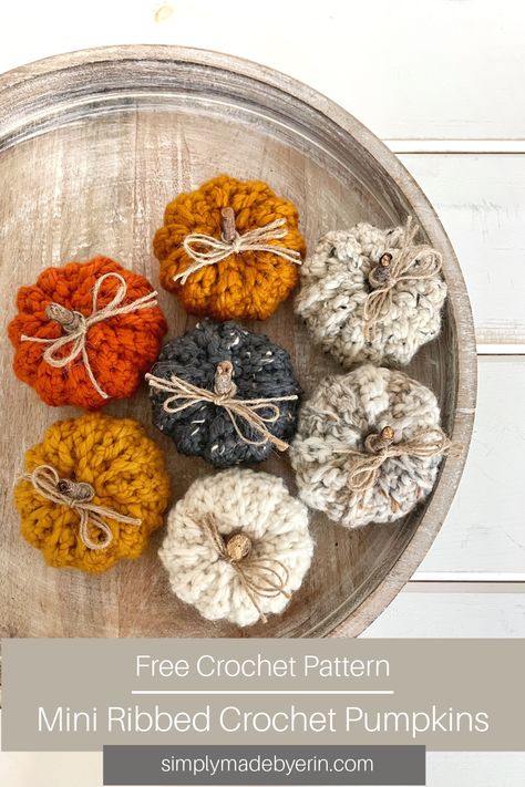 seven mini ribbed crochet pumpkins in orange and neutral colors displayed on a round decorative tray Crocheted Pumpkins, Crochet Feather, Diy Fall Decor, Pumpkin Uses, Lion Brand Wool Ease, Extra Yarn, Crochet Decrease, Fall Patterns, Crochet Basket Pattern