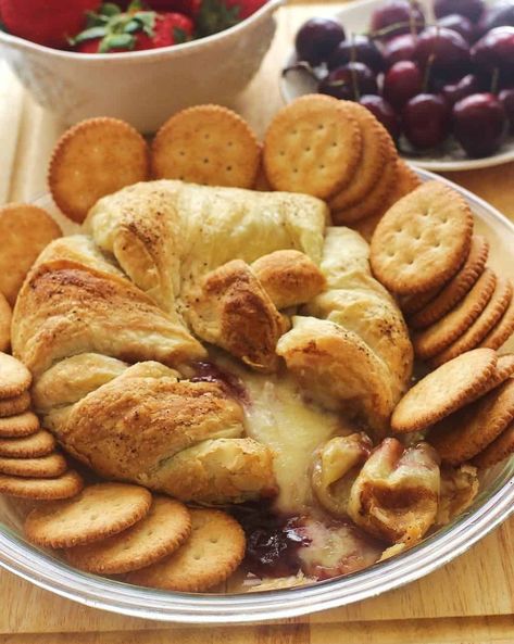 An easy, yet elegant appetizer. A wheel of brie is topped with raspberry jam and baked in puff pastry. Baked Brie In Puff Pastry, Brie In Puff Pastry, Brie Puff Pastry, Cheese Puff Pastry, Brie Recipes, Elegant Appetizers, Baked Brie, Southern Food, Puff Pastry Recipes