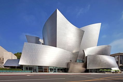 Walt Disney Concert Hall – Los Angeles Gehry was shortlisted to devise a new home for the Los Angeles Philharmonic in 1988; the project, the Walt Disney Concert Hall, finally opened in 2003. Today critics and the public agree that the iconic building was worth the wait. inside, similarly shaped panels of Douglas fir line the auditorium.  Photo: JRC/Alamy Frank Gehry Architecture, Gehry Architecture, Architecture Cool, Deconstructivism, Walt Disney Concert Hall, Vitra Design Museum, Rem Koolhaas, Vitra Design, Frank Gehry