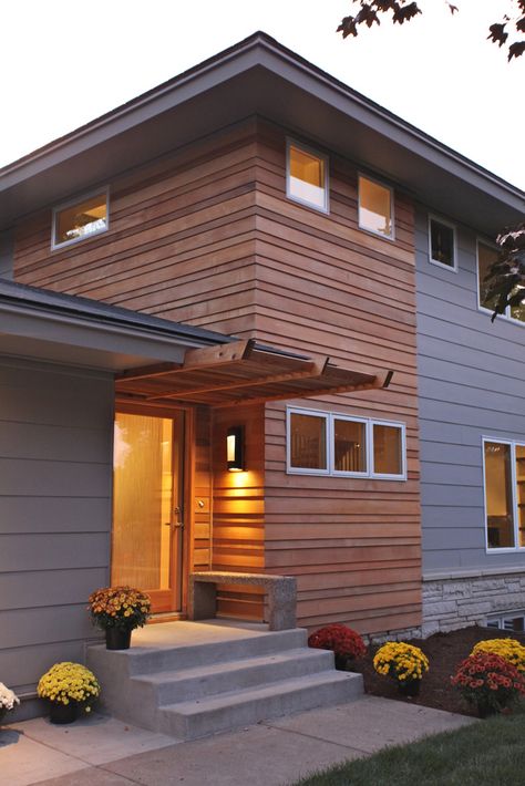 We remodeled this entire home, keeping only a few walls to comply with setback requirements.  The exterior is a combination of clear shiplap cedar, stone, aluminum and Hardie Plank siding. 70s Architecture, Wood Siding Exterior, Siding Ideas, Cypress Grove, Home Exterior Makeover, Cedar Siding, Exterior Makeover, Casa Exterior, Exterior Remodel