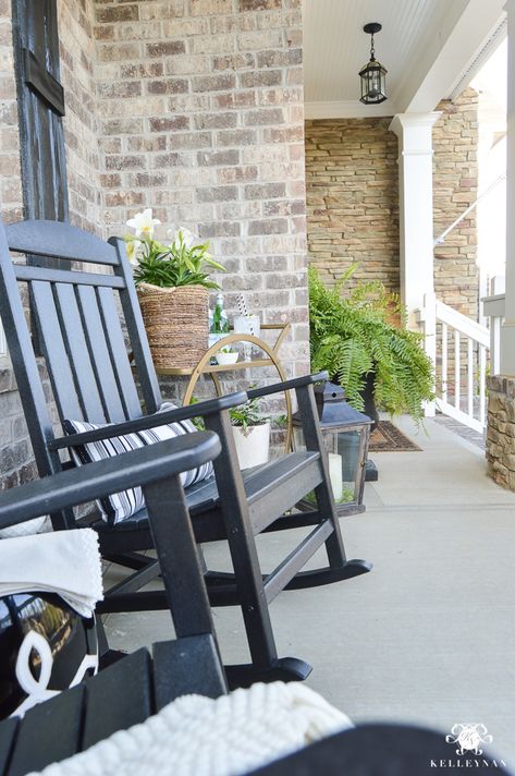 Spring Decorated Rocking Chair Front Porch with a Gold Bar Cart Polywood Black Rockers and Garen Stool Front Porch With Black Rocking Chairs, Front Porch Chairs, Front Porch Rocking Chairs, Rocking Chair Front Porch, Rocking Chair Porch, Porch Chairs, Comfy Living Room Furniture, Gold Bar Cart, Porch Rocker