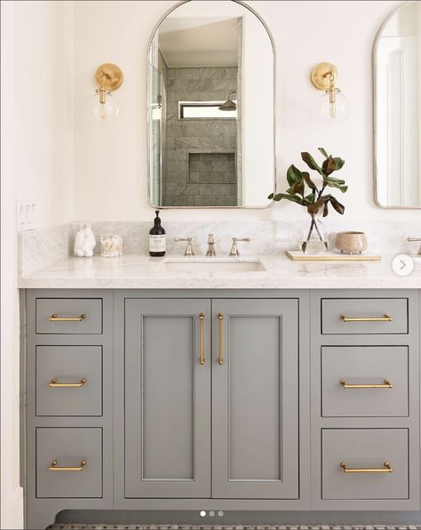 30 Beautiful Grey Bathroom Ideas To Bring A Sense Of Calm Grey Tile Bathroom Paint Color Schemes, Grey Cabinet Bathroom Ideas, Light Gray Bathroom Cabinets, Simple Basement Bathroom Ideas, Grey Vanity Bathroom Wall Colors, Gray And Beige Bathroom, Bathroom With Gray Cabinets, Grey Vanity Bathroom, Grey Cabinets Bathroom