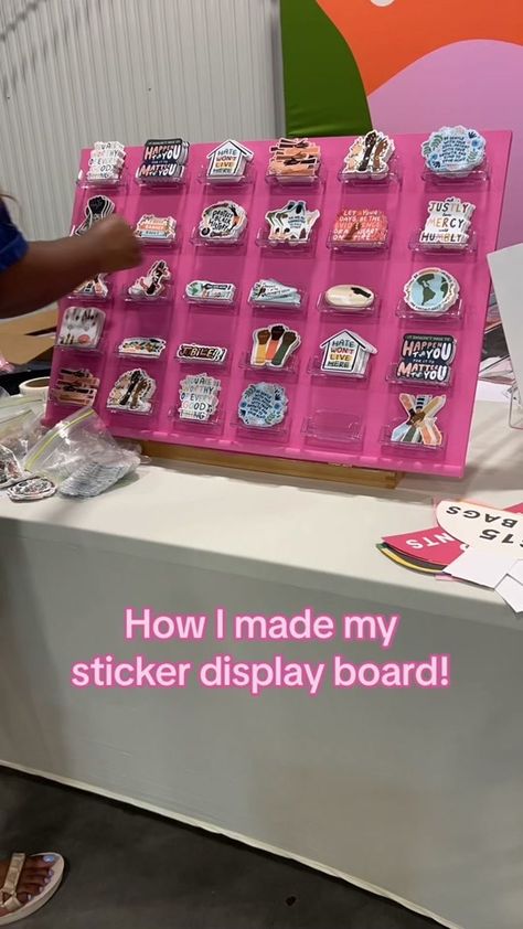 My DIY sticker display board courtesy of @Smile Cult’s tutorial 🫶🏾 r... | Diy Stickers | TikTok Best Vendor Booth Ideas, Craft Booth Sticker Display, How To Display Car Decals At Craft Show, Peg Board Sticker Display, Sticker Vendor Booth Display Ideas, Sticker Display Ideas Retail Diy, Pegboard Sticker Display, Ways To Display Stickers For Sale, Vendor Booth Display Ideas Stickers