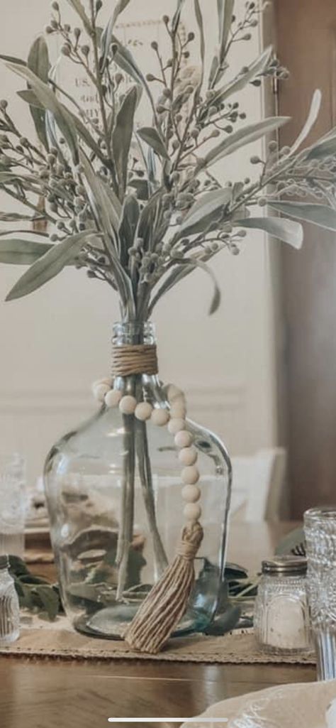 How To Style Large Glass Vase, Decorating With Glass Vases, Tall Floor Vase Arrangements Farmhouse, Big Glass Jug Decor Ideas, Big Glass Vase Decor, Glass Wine Jugs Decor, Clear Jug Decor, Gallon Glass Jug Ideas, Table Vase Decor Ideas