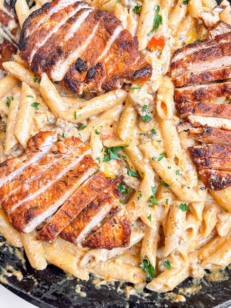 Creamy spicy Italian sausage pasta with tender blackened cajun chicken breasts. You'll adore this easy 30 minute dinner idea. Blackened Cajun Chicken, Spicy Italian Sausage Pasta, Creamy Italian Sausage Pasta, Cajun Chicken Breast, Cajun Sausage Pasta, Chicken Sausage Pasta, Batch Baking, Spicy Italian Sausage, Cajun Sausage