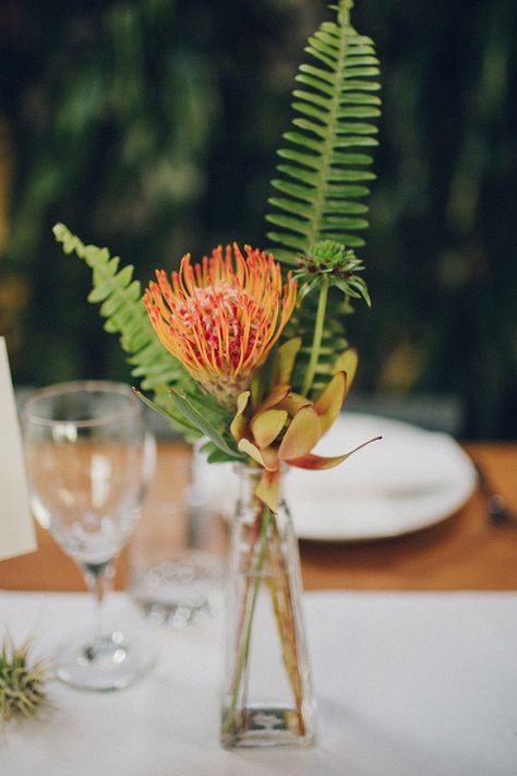 Tropical Flowers Table Decor, Tropical Bud Vase Centerpieces, Tropical Floral Centerpieces Simple, Minimalist Tropical Flower Arrangement, Tropical Flower Table Arrangements, Simple Tropical Sweetheart Table, Tropical Centerpieces Wedding Receptions, Tropical Fruit Wedding Decor, Minimal Tropical Centerpiece