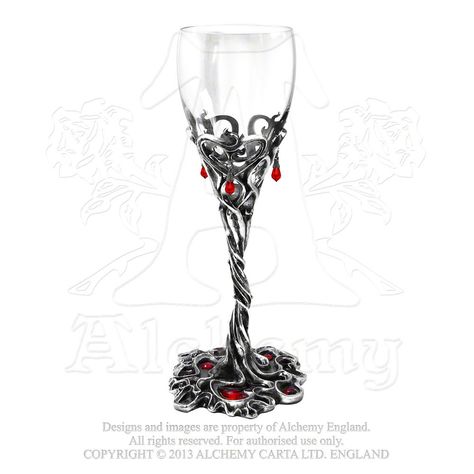 CWT43 - Dracula's Cup Wine Glass. For a dangerously intimate encounter; blood red Swarovski crystals drip from the thorns of peril and passion, and pool into the vine base with transparent enamel.  Clear tulip wine glass with pewter vine stem, Swarovski crystal blood drops and red enamelled base.   Approximate Dimensions: Width 3.15" x Height 8.82" x 3.15" Materials: Fine English Pewter, Enamel, Swarovski Crystals, Lead-Crystal Glass - Contact Tri De Dana for Details: info@tridedana.com Tulip Wine Glasses, Alchemy Gothic, Pagan Rituals, Goth Home, Goth Home Decor, Drinking Vessels, Red Cups, Veil Brides, Apollo Box