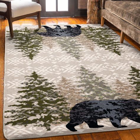 Handsome pine trees frame this stoic bear who is highlighted by charcoal high lights. The patterned field adds another layer of dimension to this iconic cabin rug. Proudly made in the USA. American Dakota Modern/Contemporary 5 x 8 Ft. Stone Indoor Lodge Area Rug | 0420STN201 Modern Lodge Decor, Northwoods Decor, Cabin Rug, Farmhouse Style Living Room Decor, Mountain House Decor, Black Bear Decor, Cabin Rugs, Ski Lodge Decor, Cabin Theme