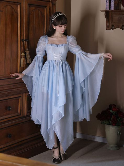 Fairy blue dress, handkerchief hem, lace-up detail bodice, and shirring back, beaded bell sleeves gives a medieval witch vibes. Comfortable silky tulle fabric.  A formal maxi dress fits so many occassions, beach party, wedding party, birthday party, renaissance festival and so on.   	 		 			Size 			S 			M 			L 		 		 			Full Length 			134 			137 			140 		 		 			Bust 			86-94 			90-98 			94-102 		 		 			Waist 			68-76 			72-80 			76-84 Cute Medieval Outfits, Ren Faire Princess Costume, Fairycore Formal Dress, Plus Size Fairy Dress, Ren Fair Wedding, Ren Fairy Costume, Fairy Gown Goddesses, Winter Fantasy Dress, Medieval Dress Blue