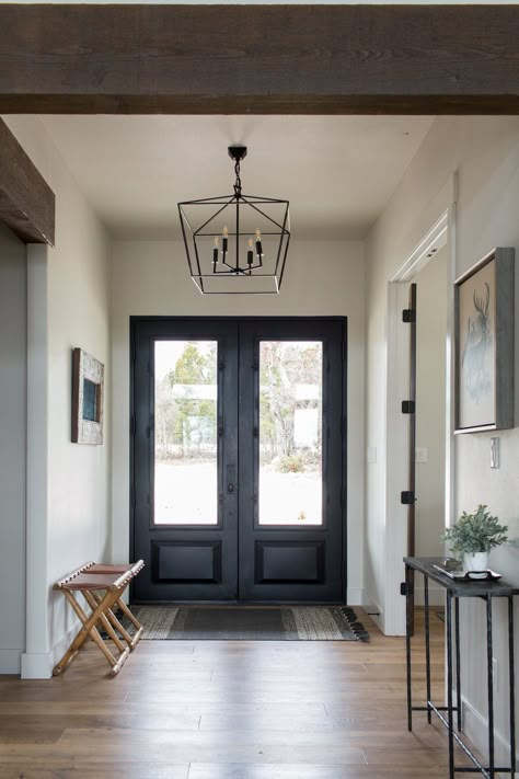 Double door entry that leads into a contemporary-style foyer. Geometric pendant lights and slim, black side tables create a crispness that is also inviting. Double Door Entryway, Modern Entry, Room Vibes, Hal Decor, Modern Entryway, Foyer Design, Entry Hall, Decoration Inspiration, Style At Home