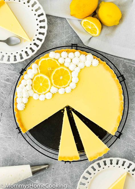 This Eggless Lemon Tart is fresh, zingy, creamy, and super easy to make! The perfect addition to your party or really any occasion. @mommyhomecookin #recipe #eggless #eggfree #lemon #tart #dessert Lemon Custard Pie, Allergy Friendly Desserts, Lemon Curd Tart, Lemon Tart Recipe, Lemon Pie Recipe, Homemade Graham Cracker Crust, Homemade Graham Crackers, Lemon Custard, Tart Filling