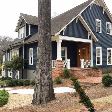 8 Siding Colors That Go Beautifully With Red Brick Exteriors | Hunker Brick House With Blue Shutters, Grey Painted Brick House, Grey Painted Brick, Dark Grey Houses, Dark Blue Houses, Farmhouse Exterior Colors, White Farmhouse Exterior, Painted Brick House, Blue Shutters