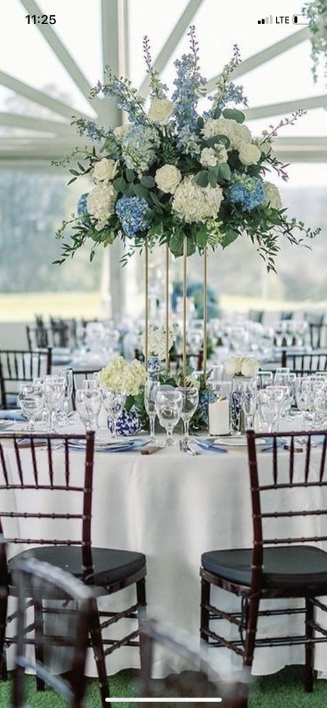 Icy Blue And Navy Wedding, Wedding Table Decor Blue And White, Blue Wedding Venue Decorations, Wedding Floral Arrangements Blue, Navy Blue Flower Centerpieces, Floral Centerpieces For Round Tables, Spring Wedding Ceremony Flowers, Gold White And Blue Wedding, Hydrangea Wedding Flowers Centerpieces