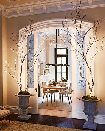 indoor tree lights Lighted Branches Decor, Woodland Christmas Decor, Martha Stewart Christmas, Christmas Lights Outside, Tree Branch Decor, Christmas Light Installation, Indoor Tree, Hanging Christmas Lights, Lighted Branches