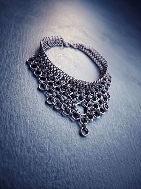 Hello! I made this Dark Goth Choker - Collar Necklace using strong & skin-friendly, hypoallergenic aluminum rings, with the ancient craft of chainmail. * This statement piece will look elegant & unique on your neck. (Be ready for curious questions ;) * It would be a perfect gift for a loved one, friend or a stylish family member 🎁 - Was made with European & Japanese chainmail patterns. - All the rings were attached to each other one by one by hand. HOW TO TAKE CARE OF YOUR ACCESSORY? * Anodized How To Make Chainmail, Chainmail Clothing, Chainmail Patterns, Gothic Choker, Chainmail Necklace, Goth Choker, Chainmail Jewelry, Choker Collar Necklace, One Friend