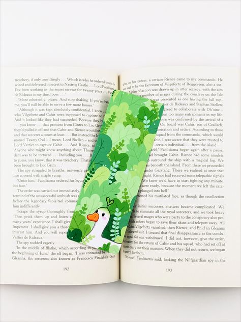 Double sided laminated handmade bookmark. A kawaii white duck standing in a leafy green forest. He has a little green sprout coming out of the top of his head. Duck Bookmark, Bookmark Inspiration, Sprout Bookmark, Nature Bookmark, Kawaii Cottagecore, Cottagecore Gifts, Nature Bookmarks, Bookmark Ideas, Bookmark Handmade