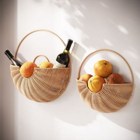 Infuse your space with the warm ambiance of the Baya Boho Basket Farmhouse Rattan Wall Art Set. These two round bamboo baskets, in tan shades, embody the heart of boho design - natural, effortless, and versatile. While they stand out as unique wall art pieces, they also offer the practicality of storage. Whether it's in the living room, bedroom, or hallway, they introduce a serene yet functional element, encapsulating the essence of boho chic. Their simple design and natural material make them a timeless addition, harmonizing seamlessly with both contemporary and traditional interiors. Size: 16.5" H x 16.5" W x 5.5" D.  Color: Brown. Rattan Wall Art, Boho Wall Basket Decor, Rattan Wall Decor, Boho Basket, Hanging Fruit Baskets, Rattan Wall, Basket Wall Art, Hallway Art, Wall Hanging Basket