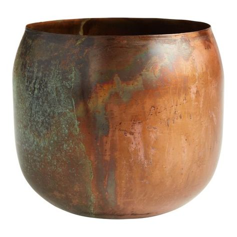 With dynamic shades of warm copper, gold, dark brown and green, our exclusive metal planter is a oneof-a-kind decor treasure. Artisans in Moradabad, India shape, hammer and finish each piece by hand, making it a vintage objet d'art when displayed alone or an antique home for a pothos or snake plant. Felted Acorns, Patina Metal, Copper Planters, Antique Home, Metal Vase, Metal Planters, Brown And Green, Snake Plant, World Market