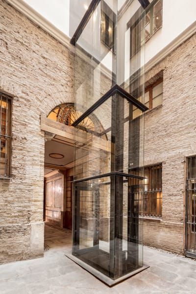 Agora Arquitectura, Adrià Goula · OPENING DOORS TO THE CITY · Divisare Elevator Interior, Stair Lift, Glass Lift, Renovation Architecture, Elevator Design, Glass Elevator, Santa Isabel, Glass Structure, Lift Design