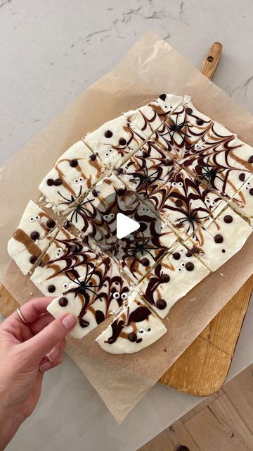 Kasey Dixon on Instagram: "EATS \ Halloween yogurt spider bark for a healthier version this season!🕸️🕷️👻 Make it extra spoooooooky by creating spider webs with dark chocolate!!🍫🕸️ See how I do it on this vid! My kiddos and Luke looooove it🖤 Comment RECIPE to get the details sent to your DMs!👩🏻‍🍳

#halloweentreats #halloweenrecipes #halloweenparty #halloweenfood #halloweenlover #halloweendecorating 

https://liketk.it/4TNs9" Halloween Yogurt Bark, Marshmallow Spider Web, Halloween Bark, Yogurt Bark, Halloween Dessert, Spider Webs, Halloween Desserts, Mini Marshmallows, Halloween Recipes