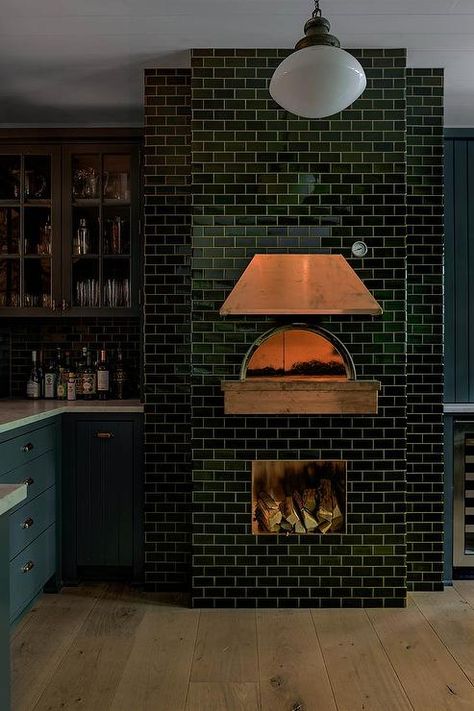 A black subway tiled pizza oven is finished with a copper hood. Pizza Oven Restaurant, Indoor Pizza Oven, Outdoor Pizza Oven Kits, Pizza Oven Fireplace, Black Subway Tiles, Oven Fireplace, Wood Burning Pizza Oven, Copper Hood, Brick Oven Pizza