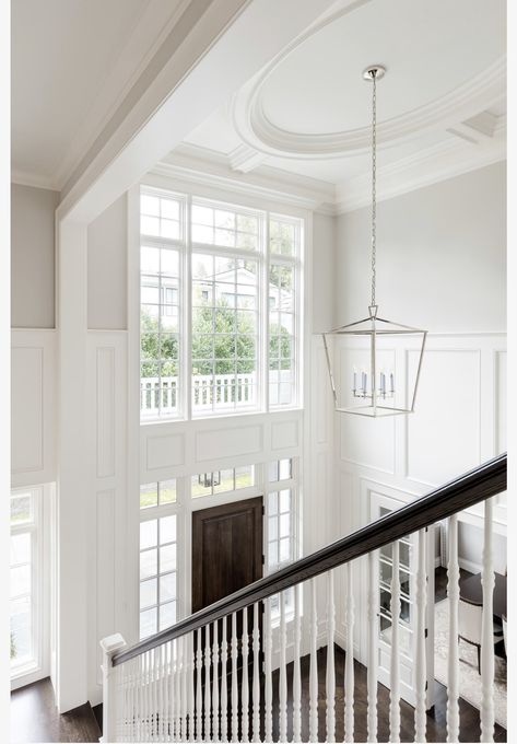 Two Story Foyer Ideas Entryway, Foyer Molding, 2 Story Foyer Lighting, Dark Stained Wood Floors, White Marble Tile Floor, Stairs Entryway, Foyer Ideas Entryway, White Staircase, Wainscoting Ideas