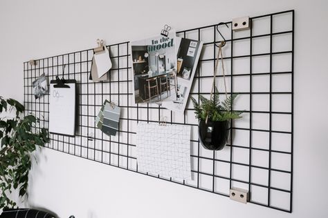 Make your own DIY Metal Wall Grid to help organize your office and home! This nordic inspired black wire organizer is a gorgeous statement piece! Love the idea of styling this piece with plants, home ideas, and pictures to make a beautiful vision board! #desk #office #dorm #bedroom #inspiration Office Grid Wall, Aesthetic Wall Grid Ideas, Grid Board Ideas, Metal Grid Wall Decor, Diy Wall Grid, Metal Wall Grid, Wire Board, Grid Board, Wall Grid