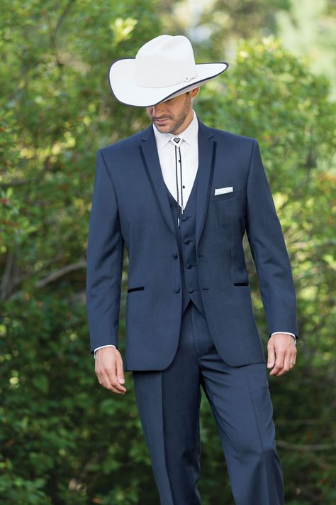 Wear a bolo or string tie to complement the country theme. And don’t forget the cowboy hat and boots! Mens Western Suits Country Weddings, Navy Cowboy Wedding, Suit With Western Boots Men, Cowboy Outfit Wedding, Men Wedding Outfit Western, Bolo Tie Tuxedo, Cowboy Formal Wear Men Western Weddings, Western Tuxedo Cowboys, Elegant Cowboy Outfit For Men