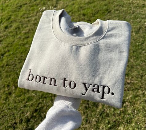 Elevate your wardrobe with our "born to yap" Embroidered Sweatshirt, the perfect blend of style and humor! This cozy sweatshirt features high-quality embroidery that adds a touch of flair to your everyday look. Our sweatshirt makes a great gift for her, whether you're shopping for a friend, or yourself. It's a fun shirt that's perfect for any occasion. Treat yourself or surprise a friend with this unique piece. It also makes a thoughtful gift for birthdays, holidays, or any special occasion. HOW Cute Thoughtful Gifts For Best Friend, Born To Yap Hoodie, 22 Year Old Christmas Gifts, Circuit Sweatshirt Ideas, Cricket Sweatshirt Ideas, Born To Yap, Gifts For 30 Year Old Women, Christmas Gifts For Little Sister, Cricut Gifts For Friends