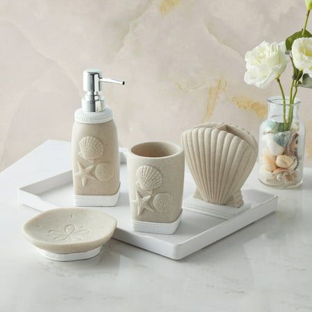 Bring the seashore to your bathroom with bathroom accessory set. This lovely handcrafted resin collection is luxurious, stylish, and helps keep your bathroom decor clean, fresh, and organized. The set includes: A tumbler, lotion/soap dispenser, toothbrush holder and soap dish. Accessory collection is designed with an and Each piece is hand crafted in a durable resin. Easy to wipe clean and made to last a lifetime. This ultra-luxurious collection will surely add contemporary charm to your bathroo Bathroom Beach Theme, Small Coastal Bathroom, Shell Bathroom, Coastal Bathroom Decor, 4 Piece Bathroom, Brown Bathroom, Coastal Bathrooms, Bathroom Accessories Sets, Bath Accessories Set