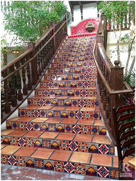 Mexican Tile Staircase - Any Mexican food restaurant needs a GRAND staircase like this one!  The stair tread tile is handmade terra cotta tile.  Talavera tile serves as the stair risers.  The look is completed by a Cantera stone fountain that sits at the top of these stairs in this Mexican food restaurant - Pancho's Las Vegas. Get this look from Rustico Tile and Stone. Not only do we offer wholesale prices, but we also ship WORLDWIDE! Mexican Tile Stairs, Restaurant Tiles, Cantera Stone, Tiled Staircase, Rustic Staircase, Spanish Style Decor, Tile Steps, Mexican Hacienda, Saltillo Tile