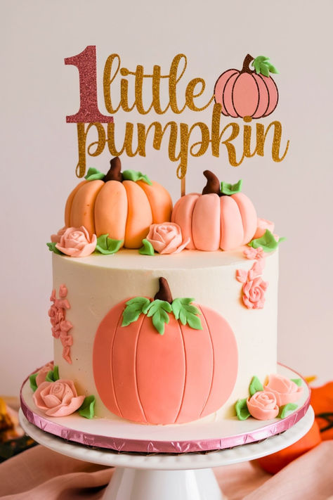 This image features a charming "Little Pumpkin First Birthday Cake" with pink and peach pumpkins, perfect for a fall-themed celebration. The gold glitter "1 Little Pumpkin" topper adds a cute touch, ideal for an "Our Pumpkin is Turning One" party. This cake is perfect for a "Pumpkin Theme Smash Cake" and fits beautifully with first birthday fall ideas. Pumpkin Baby Shower Cake Girl, Our Pumpkin Is Turning One Party Girl, September 1st Birthday Girl, Fall 1st Birthday Girl Themes, Pumpkin 1st Birthday Cake, Fall First Birthday Girl, Pink Pumpkin Cake, Pumpkin First Birthday Cake, Pumpkin 1st Birthday Girl