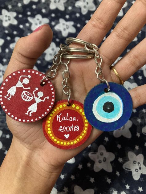 Are you in search good, eco-friendly keychains?Then you are in the right place!😁😍Check out these super cool handmade keychains! 🫶🏼 We assure they will look great with your keys, bag zips or pouches!!😁🥰❤️So what are your waiting for? DM us to get yours! 😍 . PS- Customisation available for the last keychain design in the row!🥰 #keychains #keychainsforsale #handmadekeychains #warliartkeychain #evileyekeychain #customisedkeychains Keychain Using Clay, Hand Made Keychains, Handmade Clay Keychains, Wooden Keychain Painting, Handmade Keychain Ideas, Keychain With Clay, Clay Keychain Diy, Cd Keychain, Clay Key Ring