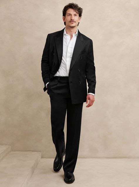 Elevate your formal attire with a sophisticated black double-breasted suit paired with a white dress shirt and sleek black Chelsea boots. A simple and flawless ensemble that blends timeless elegance with contemporary flair. Black Gala Outfit Men, Black Formal Wear Men, Black Suit Men Outfit, Ceremony Outfit Men, Men Black Tie Wedding Guest Attire, Black And White Gala Outfit, Man Formal Outfit, Black Suit Outfit Men, Formal Mens Fashion Wedding