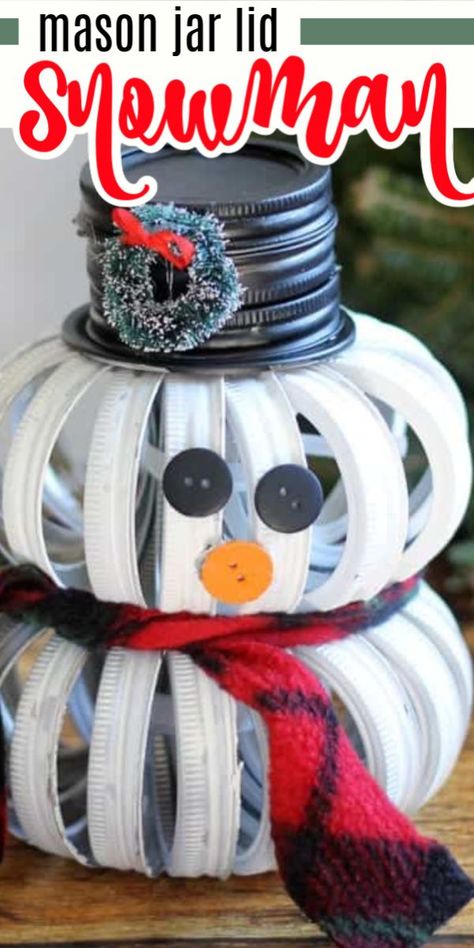 If you liked our Mason Jar Lid Pumpkins, you'll love this adorable mason jar lid snowman! It's a cute and unique holiday craft that is sure to be a conversation piece. #masonjar #masonjarlid #christmascrafts #christmasdecor #diychristmasdecor #winterdecor #wintercrafts #craftsbyamanda Mason Jar Lid Pumpkin Diy, Jar Lid Pumpkins Diy, Mason Jar Ring Pumpkin Diy, Canning Ring Snowman, Mason Jar Ring Snowman, What To Do With Mason Jar Lids, Jar Lid Christmas Crafts, Mason Jar Lid Snowman, Snowman Mason Jar Lids